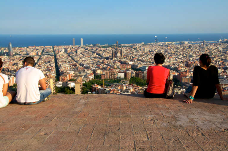 young people in barcelona watching skyline