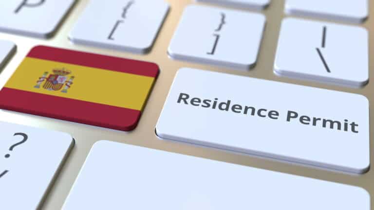 Residence Permit text and flag of Spain on the buttons on the computer keyboard. Immigration related conceptual 3D rendering